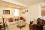 Adjacent den with a sleeper sofa